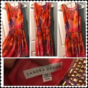 Gorgeous woman’s party/wedding guest knee length dress